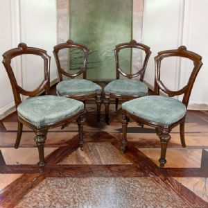 Set of four antique carved English style chairs